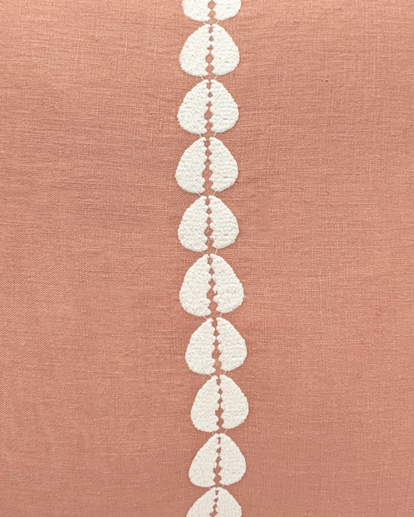 cowrie embroidered pillow in sandalwood