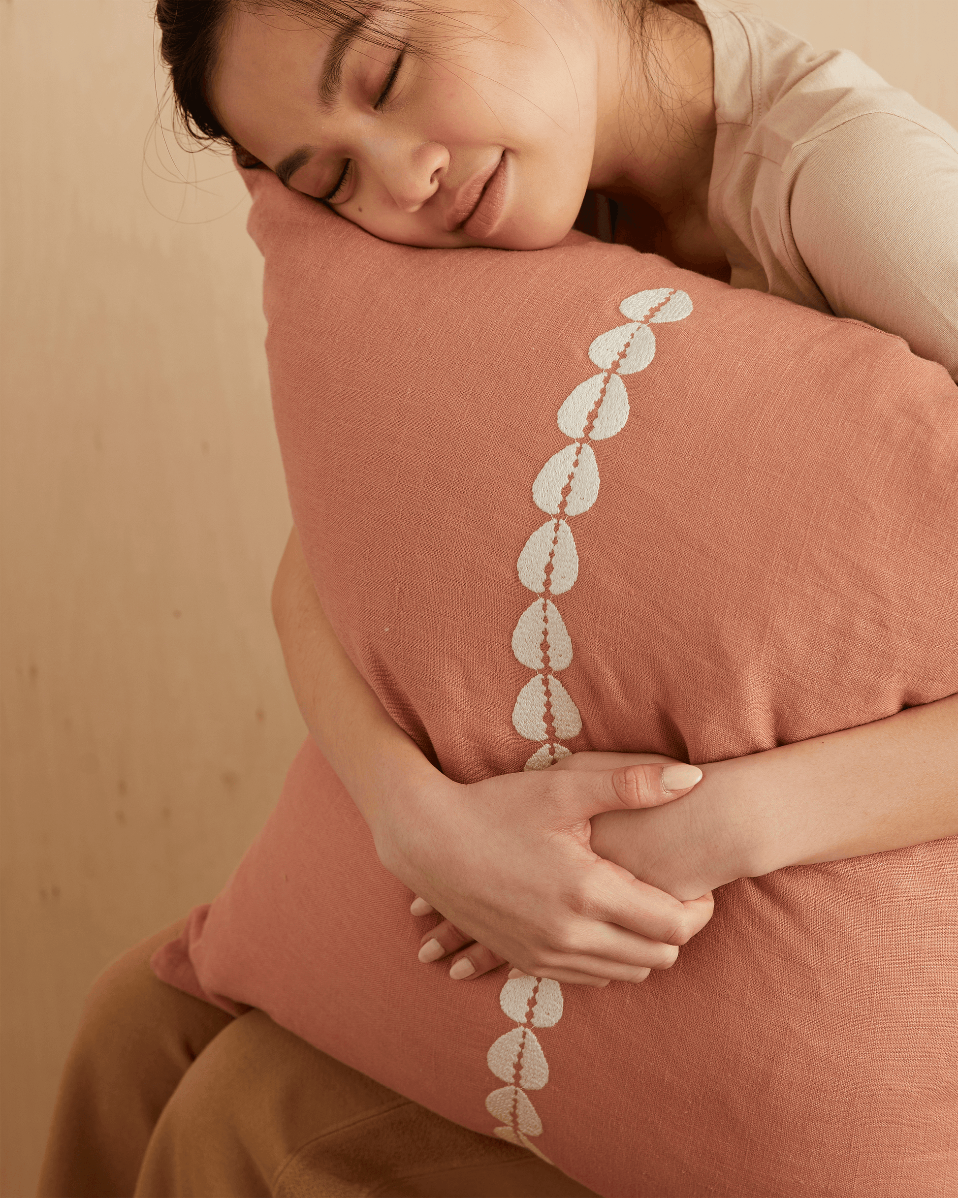 cowrie embroidered pillow in sandalwood - PILLOWPIA